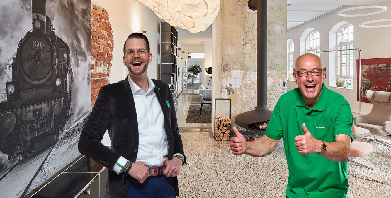 Zwei Mitarbeiter von Streit Service & Solution tragen Berufsbekleidung
